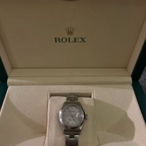 Rolex Silver Watch with White Dial